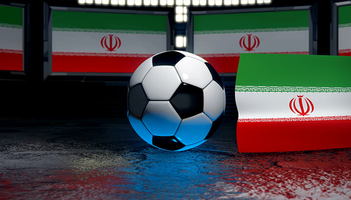 فوتیج پرچم ایران در کنار توپ فوتبال به اهتزاز درمی آید